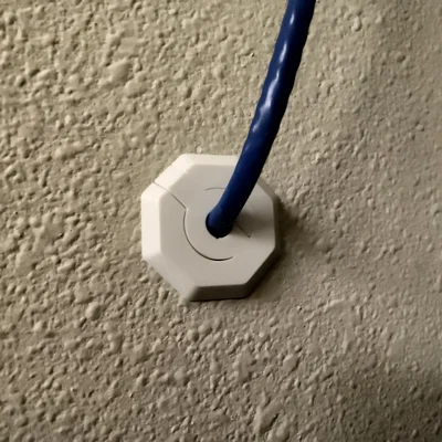 Ốp luồn dây xuyên tường (Wall grommet)