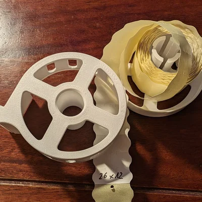 Giá đỡ cuộn tem dán 26x12mm cho xạ thủ (Target patch dispenser)