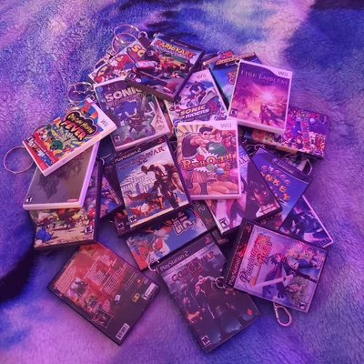 Hộp mini game dạng DVD (Wii/GameCube/Xbox 360/PS2) làm keychain