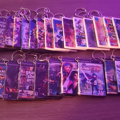 Hộp mini game dạng DVD (Wii/GameCube/Xbox 360/PS2) làm keychain