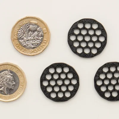 Token xe đẩy £1 (Pound) – Tối ưu giảm vật liệu in