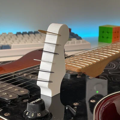 Giá đựng pick đàn Guitar hình đầu cần đàn