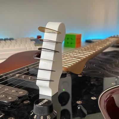 Giá đựng pick đàn Guitar hình đầu cần đàn