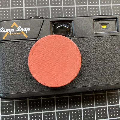 Nắp đậy ống kính 3D cho máy ảnh Camp Snap đơn giản và tiện lợi