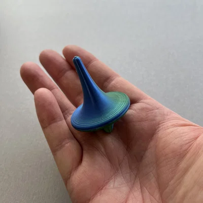 Con Quay Spinning Top