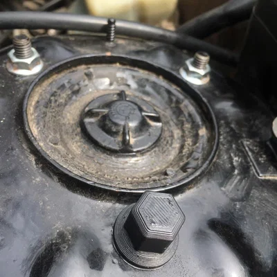 BMW E30 - Nắp chụp ốc chốt phuộc trước (front strut pin nut cap)