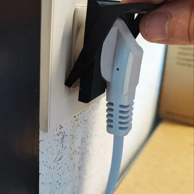 Dụng cụ hỗ trợ rút phích cắm điện an toàn (Débranche prise murale)
