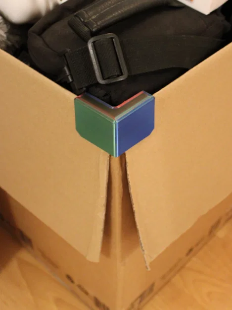 Góc giữ nắp thùng carton (Cardboard box flap holder corner) - Image 1