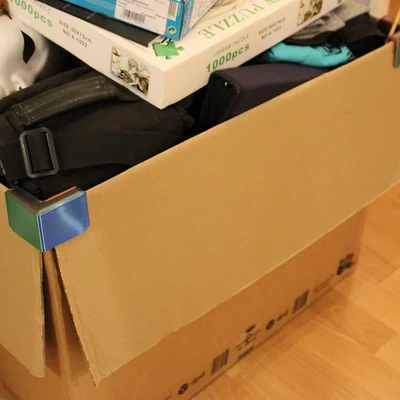 Góc giữ nắp thùng carton (Cardboard box flap holder corner)