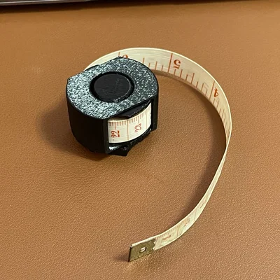 Ống cuộn thước dây Print-in-place (Tape Measure Spooler)