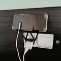 Giá đỡ điện thoại thông minh gắn củ sạc tiện lợi - Thumbnail 1