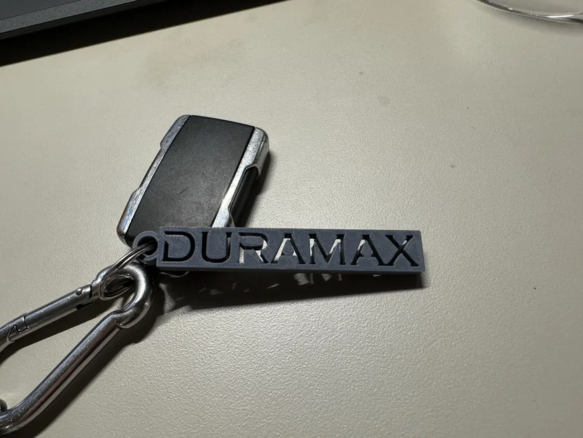 Móc khóa logo Duramax - Thiết kế đơn giản và tinh tế cho dân chơi xe - Image 2