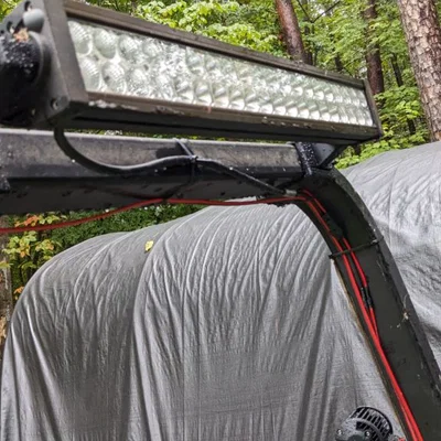 Bộ gá đèn (worklight/lightbar) cho ROP của JD 3038e (gen 1)