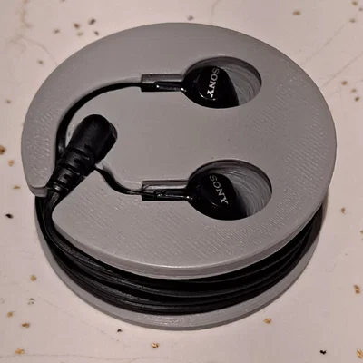 Puck quấn dây tai nghe (Headphone puck)