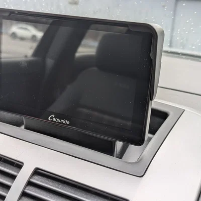 Giá nâng gắn Carpuride W701 cho khay taplo VW Polo 9N3