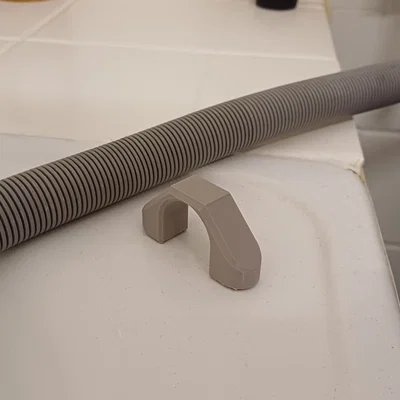 Kẹp giữ ống xả máy giặt (nam châm) – Washing machine drain hose holder