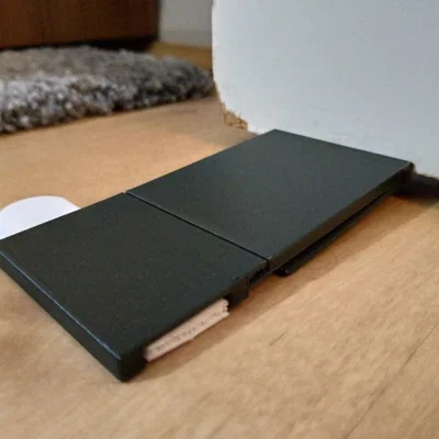 Chặn cửa nhả bằng cách đạp (Step-to-release doorstop)