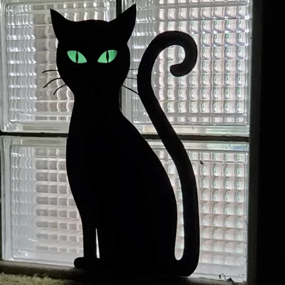 Silhouette Mèo Mắt Phát Sáng