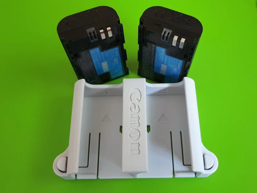 Nhiều khay pin Canon LP-E6 có nút nhả (Several LP-E6 battery packs) - Image 1