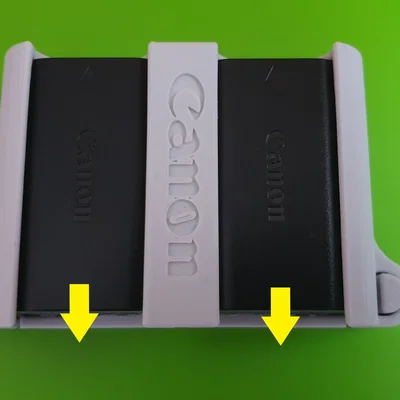 Nhiều khay pin Canon LP-E6 có nút nhả (Several LP-E6 battery packs)