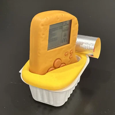 Đế dựng cốc sốt McTetris cho máy McNugget Tetris handheld