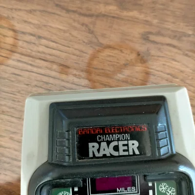 Nắp đậy pin cho máy chơi game cầm tay Bandai Champion Racer