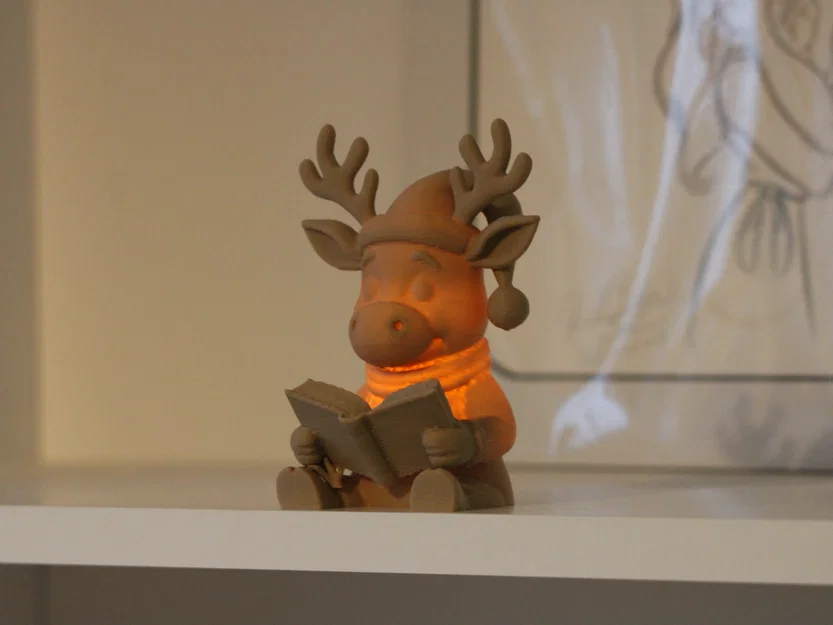 Tuần lộc Rudolph đọc sách – Tealight <30g - Image 1