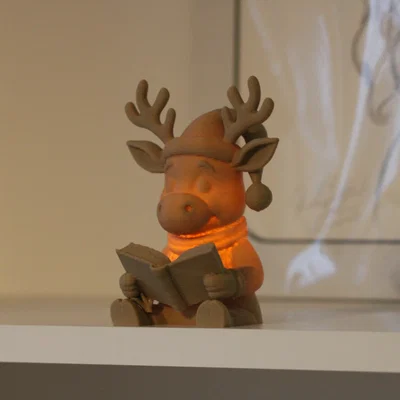 Tuần lộc Rudolph đọc sách – Tealight <30g