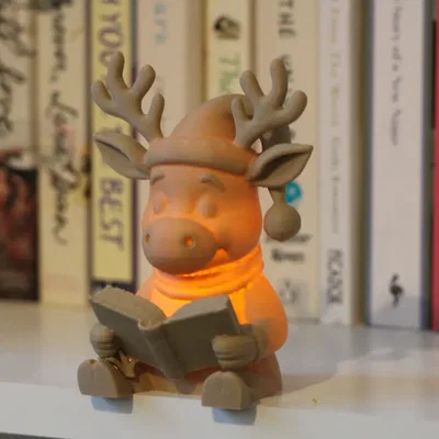 Tuần lộc Rudolph đọc sách – Tealight <30g
