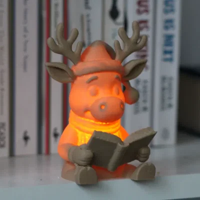 Tuần lộc Rudolph đọc sách – Tealight <30g