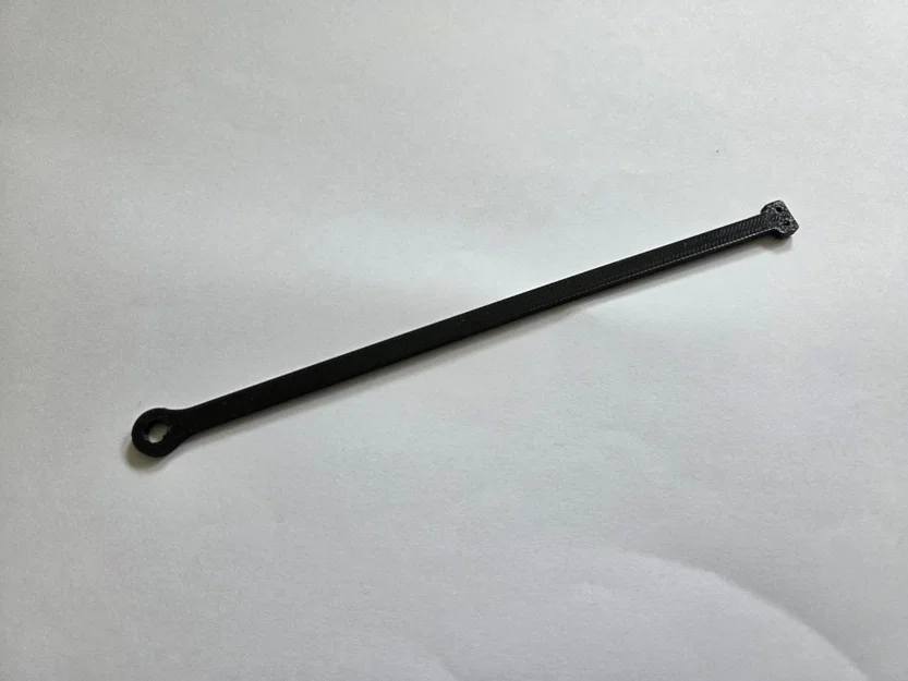 Dây giữ (retaining strap) cho nắp xăng - Image 1