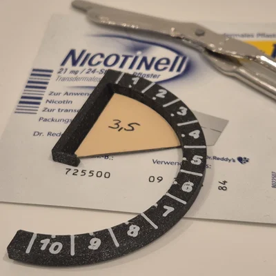 Khuôn cắt miếng dán Nicotinell 21mg theo liều (Nictoine Patch cutting aid)