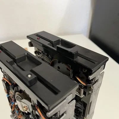 Tay gạt khóa ổ đĩa mềm Mitsubishi MF501B (floppy lock arm)