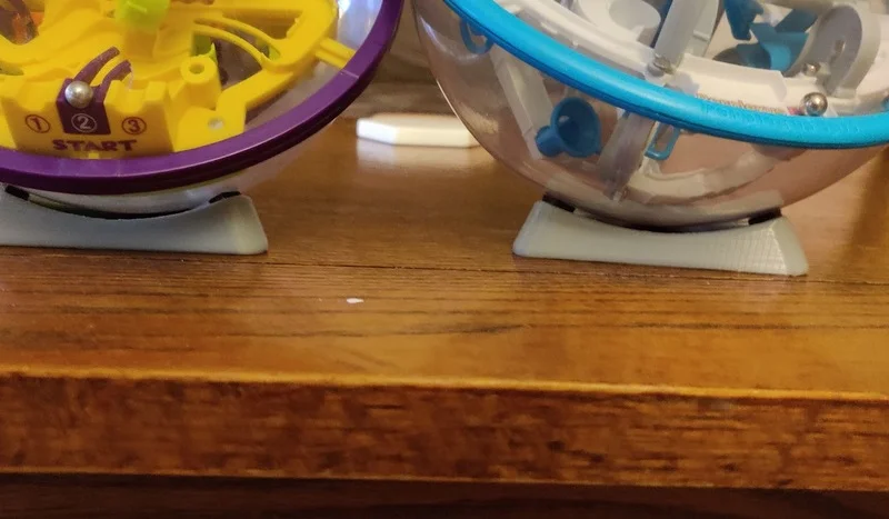Đế giữ cho quả cầu Perplexus