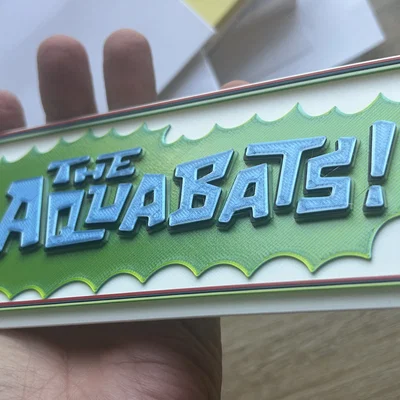 Mô hình 3D logo tour diễn 2026 của ban nhạc ska The Aquabats