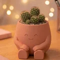 Chậu cây chú bé ngồi - Phụ kiện trang trí bàn làm việc cực xinh - Thumbnail 1