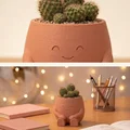 Chậu cây chú bé ngồi - Phụ kiện trang trí bàn làm việc cực xinh - Thumbnail 2