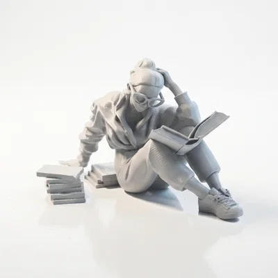 Mô hình 3D người phụ nữ ngồi đọc sách