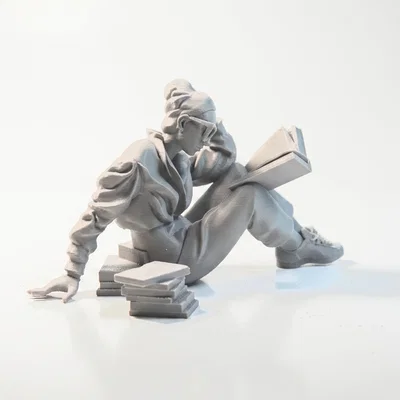 Mô hình 3D người phụ nữ ngồi đọc sách
