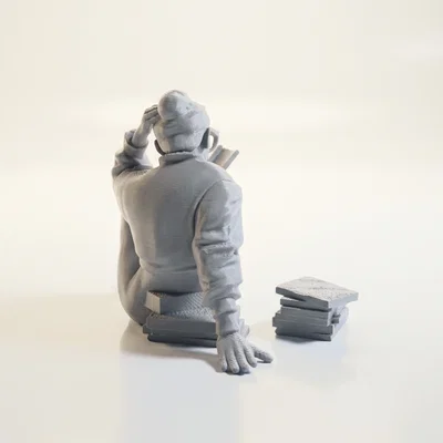 Mô hình 3D người phụ nữ ngồi đọc sách