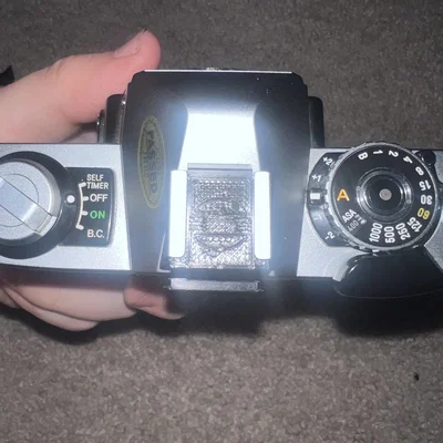 Nắp đậy Hot Shoe Minolta logo mặt trời mọc