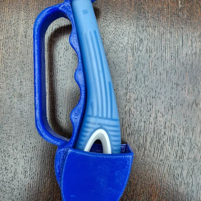 Tay cầm hỗ trợ chải tóc (Hair brush gripper)