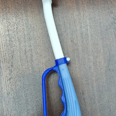 Tay cầm hỗ trợ chải tóc (Hair brush gripper)
