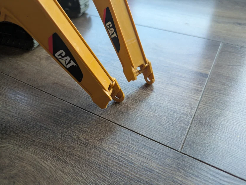 Bát kẹp sửa chữa cánh tay cần cho xe xúc Bruder CAT Midi - Image 2