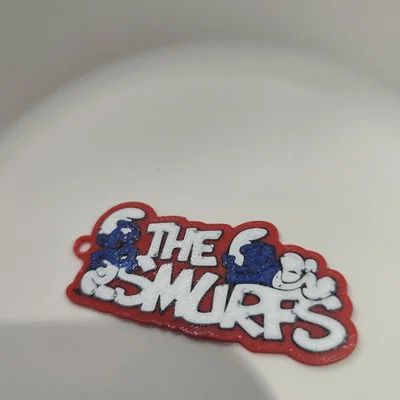 Móc khóa logo The Smurfs in 3D dễ thương cho fan nhí