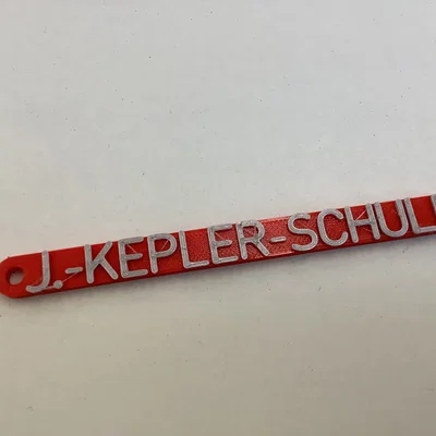 Móc khóa in 3D tên trường Johannes Kepler cá tính