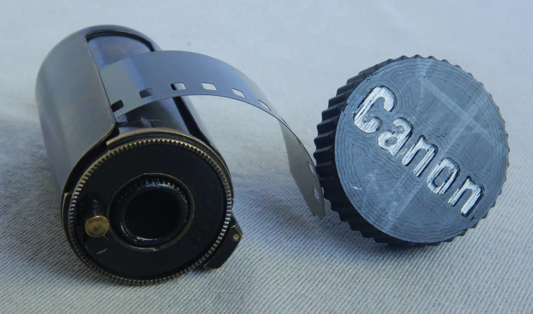 Núm vặn cuộn phim cho ống phim nạp lại Canon - Image 1