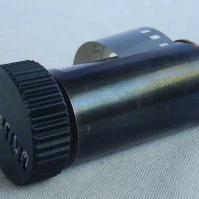 Núm vặn cuộn phim cho ống phim nạp lại Canon