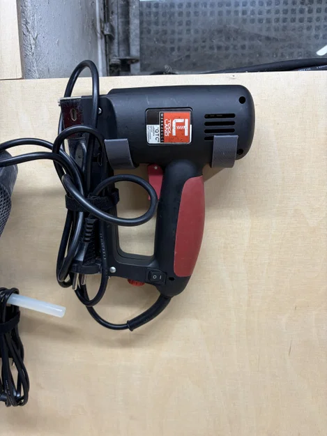 Giá treo súng bắn ghim điện lên tường đơn giản dễ in - Image 1