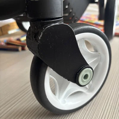 Cụm bánh xe cho xe đẩy đồ chơi Maxi Cosi